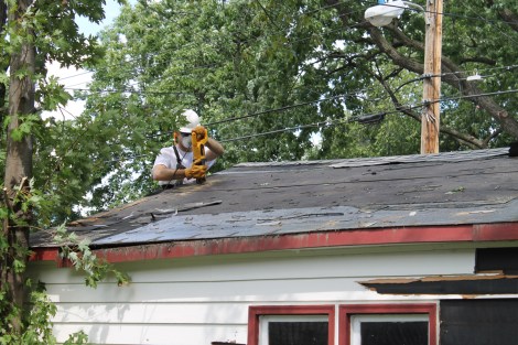 Cutting through the roof sheathing and rafters