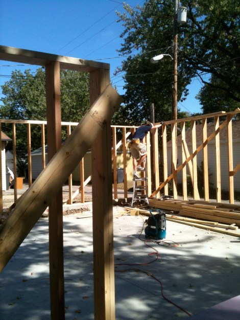 Attaching the second top plate to tie the walls together